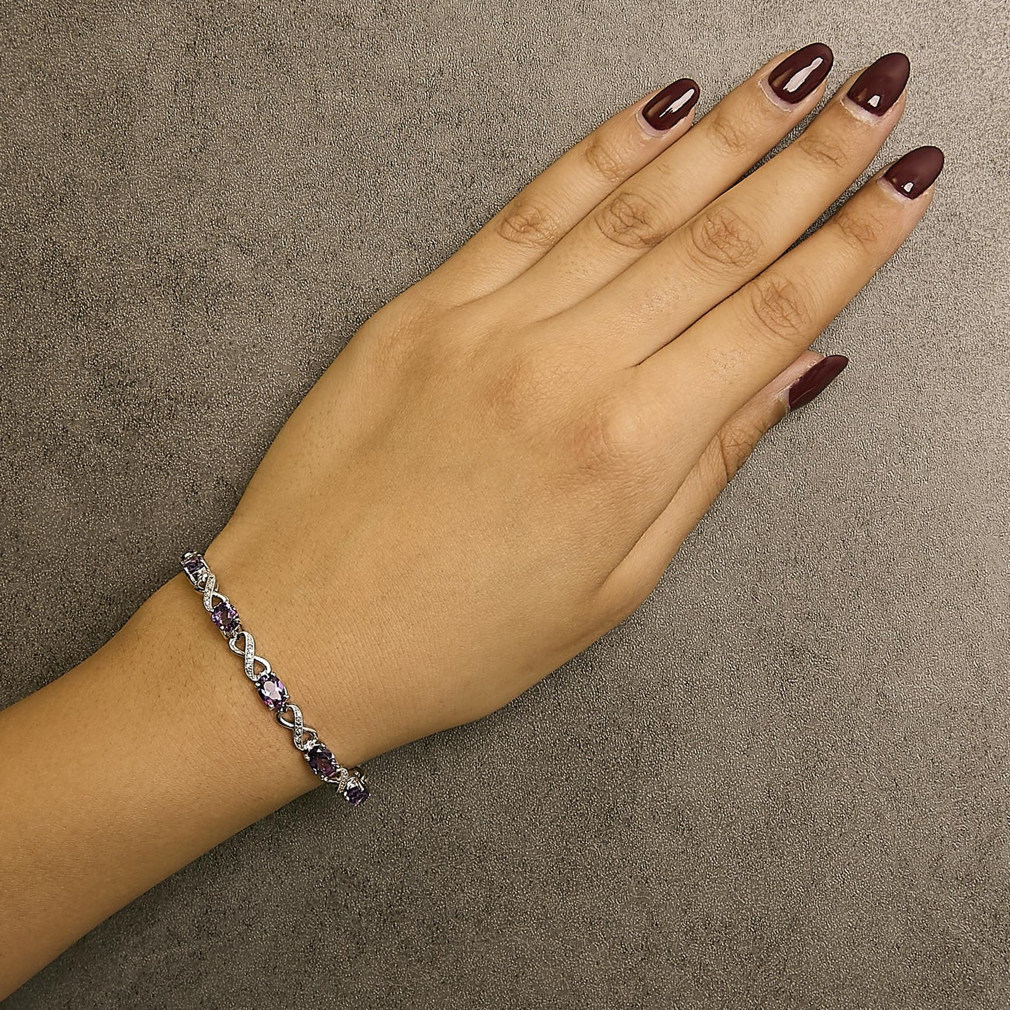 .925 Sterling Silver Oval Purple Amethyst and Diamond Infinity Link Bracelet (I-J Color, I1-I2 Clarity) - 7" Inches